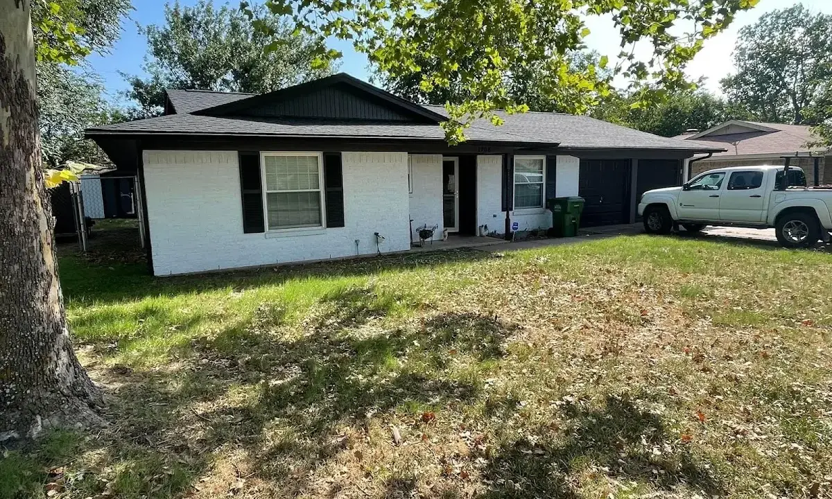 Professional roofing crew working on a residential roof in Helena Valley Northwest